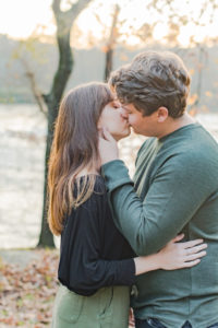Romantic candid kiss between a young couple