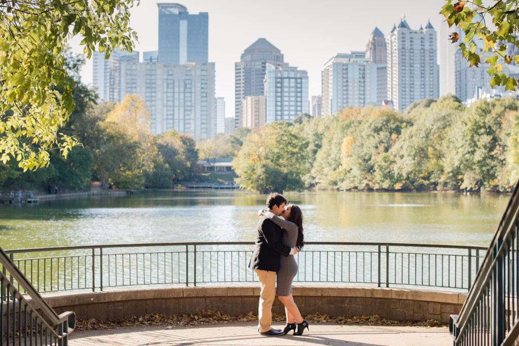 Piedmont Park proposal, Kat and Eric kiss shot, Atlanta skyline coupe session, Atlanta skyline shot