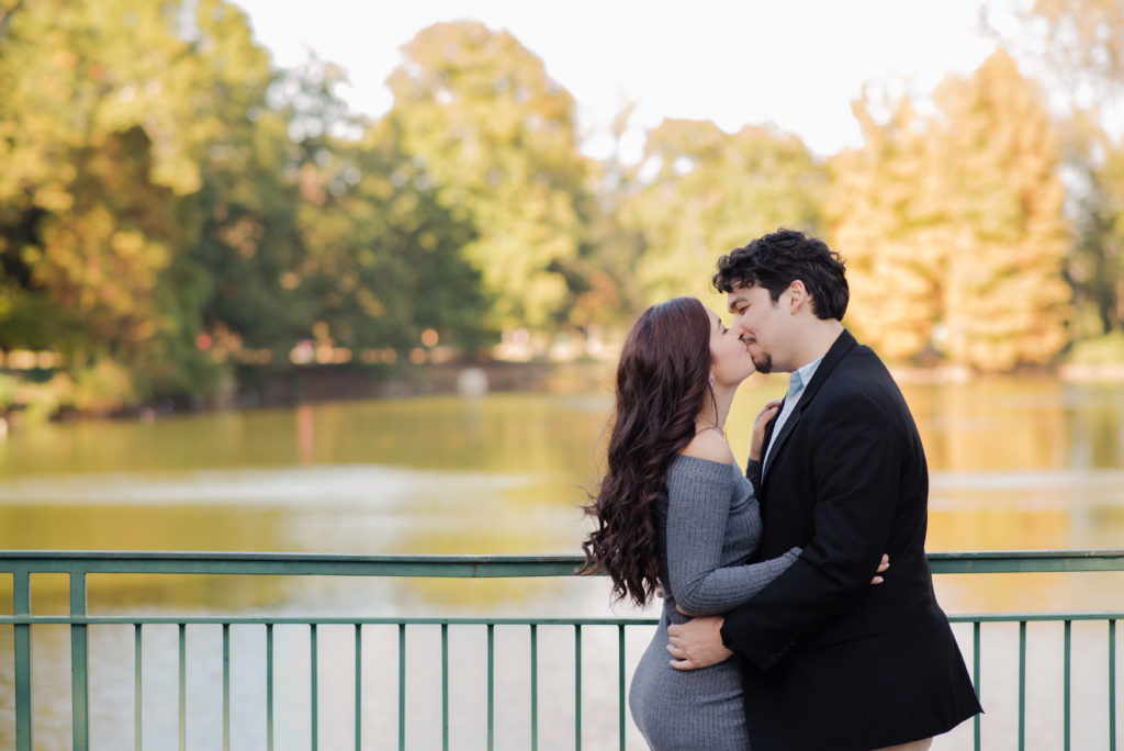 Newly engaged couple kissing at Piedmont Park Atlanta