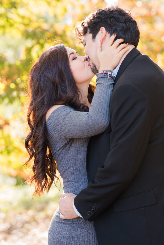 Newly engage at Piedmont Park Atlanta, engaged, gray dress,kissing, engaged, intimate kiss, intimate engagement photos,Candace Abbitt Photography