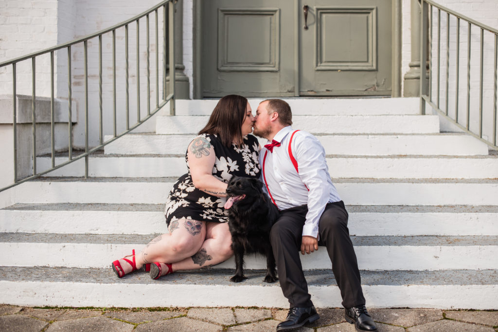 Engaged couple sitting on steps in Newnan GA