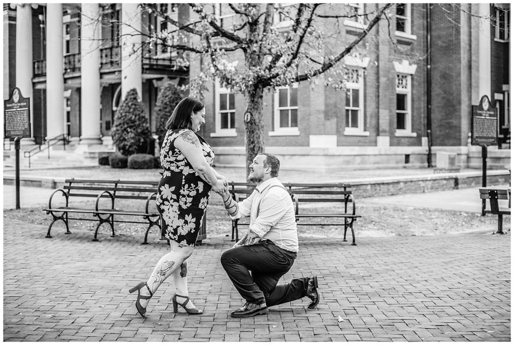 Man proposing to woman on court square in Newnan GA